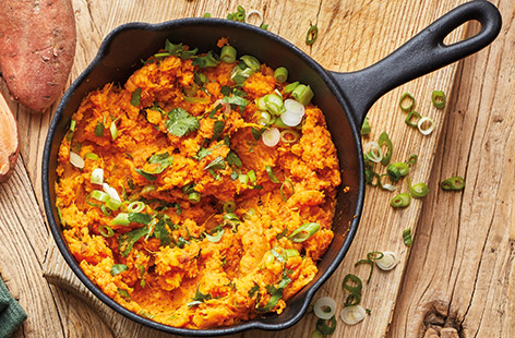 Give classic mashed sweet potatoes a fiery makeover with chipotle chilli paste, spring onions and zesty coriander for a winning side dish idea
