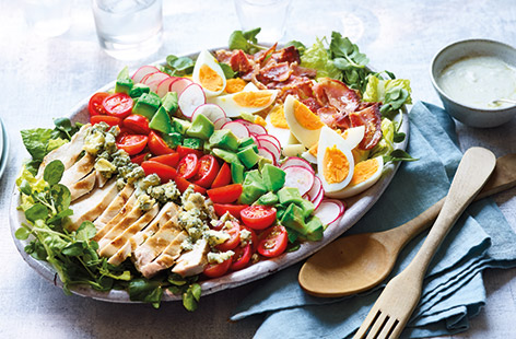 This all-American classic cobb salad recipe lines up crispy bacon, succulent chicken and golden boiled eggs with plenty of colourful veg and a drizzle of creamy blue cheese dressing, for an indulgent salad more than worthy of main course status.