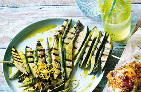 Add some fresh flavours to your barbecue with simple veggie sides. These speedy courgette and asparagus skewers flavoured with olive oil and lemon zest make a fun vegan addition to a barbecue spread. 