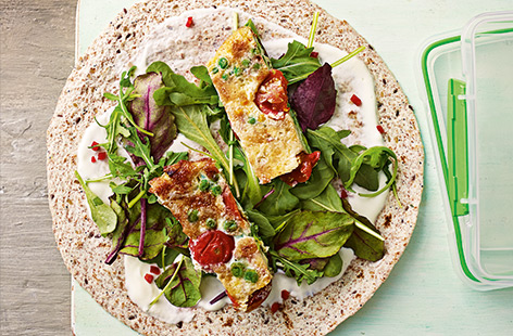 Packed with tangy tomatoes, fresh garlic and sweet peas, frittata is a great way to add extra protein to your lunch, especially when spiced with a little chilli.