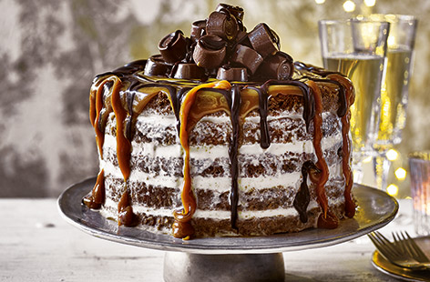 The only thing better than homemade chocolate chip cookies is a giant stack of them, sandwiched together with festively spiced vanilla ice cream and dripping in caramel and chocolate sauce.