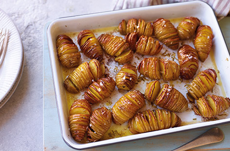 Swap your classic roasties for these simple hasselback potatoes. Baby potatoes are sliced thinly down the middle, drizzled with plenty of garlic butter and roasted until crisp on the outside and perfectly fluffy in the centre – the ideal side dish for your