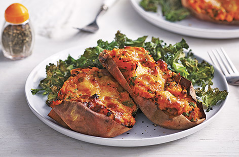Load up baked sweet potatoes with bacon, garlic and crème fraîche for a comforting family dinner that's completely gluten-free
