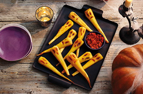 These spooky parsnip ghosts make a super scary veg snack for your Halloween party, and they're healthy too. Carve eyes and mouths into parsnips, drizzle with honey and roast until golden