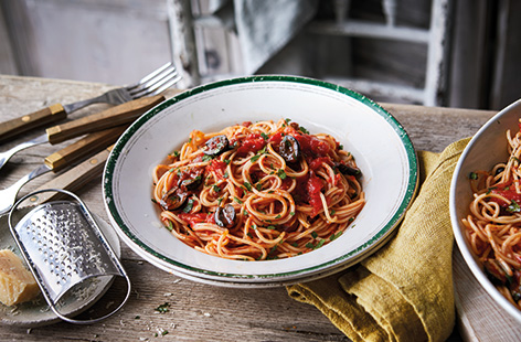 Delve into your store cupboard for a classic Italian pasta puttanesca. This spicy tomato sauce has a kick of chilli heat and is loaded with garlic, capers, anchovies and olives for a super speedy midweek meal, ready in under 30 minutes.  