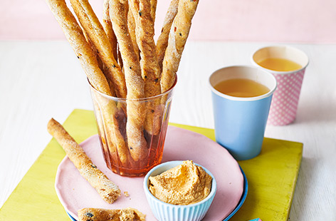 Snack on the go with these Italian-inspired pizza breadsticks. With olives, sundried tomatoes and herby Italian seasoning, kids will to help make this easy breadstick recipe for a fun summer holidays baking project.