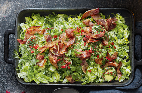 Stir-fry shredded festive greens with delicious smoky bacon for a surprising Christmas dinner side