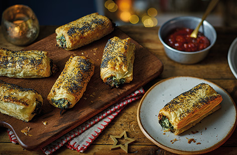 Bake a batch of vegetarian sausage rolls for a crowd-pleasing snack, whether at a Boxing Day buffet or a family picnic. With a creamy spinach and ricotta filling wrapped in crisp puff pastry, these easy bakes are sure to go down a treat.