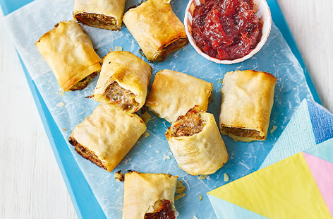 A few clever tricks make these sausage rolls a great healthy snack idea for kids. Mixing sausagemeat with veg, lentils and herbs keeps them moist and full of flavour, then swapping filo pastry for the standard puff gives a super-crispy crust. 