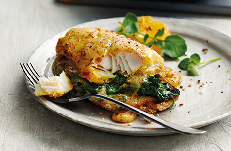 Try a new take on traditional Welsh rarebit with flaky smoked haddock and tender baby spinach