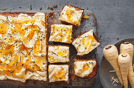 Top this spiced parsnip cake with creamy cheese frosting and fiery ginger for a delicious seasonal bake.