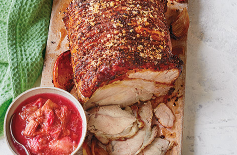 For an Easter lunch with a difference, try this spiced roast pork recipe with tangy orange and rhubarb sauce. 