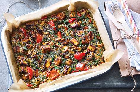 This colourful Indian-inspired traybake recipe is the perfect vegetarian summer lunch. The tandoori-spiced, veg-packed twist on a frittata is filled with sweet red peppers, creamy paneer cheese and plenty of fresh coriander for an easy portable lunch.