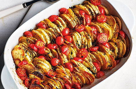 This tasty potato bake with tangy cherry tomatoes and fragrant oregano is the ideal side dish recipe for an Easter feast or Sunday roast