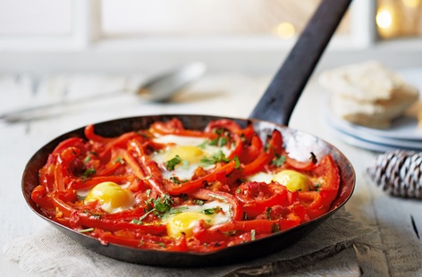 For a quick and easy brunch dish, try this rustic baked eggs recipe made with vibrant red peppers, spicy chilli and fragrant turmeric and saffron