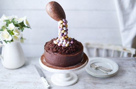 This wow-factor gravity cake is perfect for an extravagant Easter or birthday celebration. Filled with chocolate, double cream and cherry jam and topped with mini Easter eggs, this is the ultimate indulgent dessert. 
