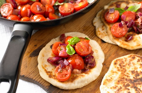 For a quick and easy Mother's Day recipe that the kids will love helping to make try these delicious tomato and garlic flatbreads. With sweet cherry tomatoes, a drizzle of sticky honey and a few sprigs of fresh rosemary, it's bursting with flavour