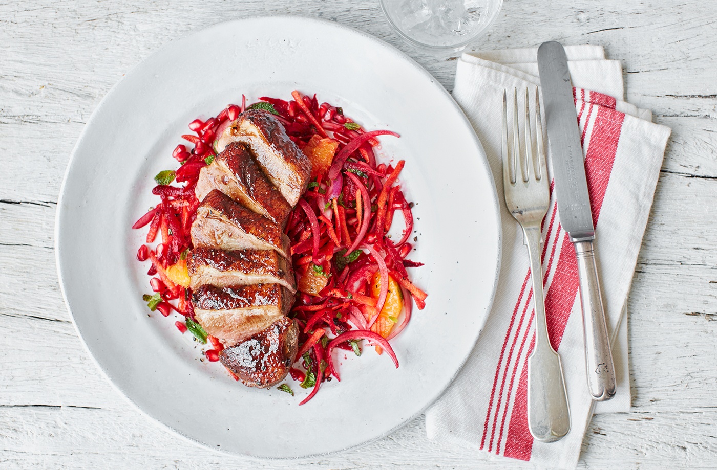 Spiced duck breasts with beetroot, orange and pomegranate slaw recipe