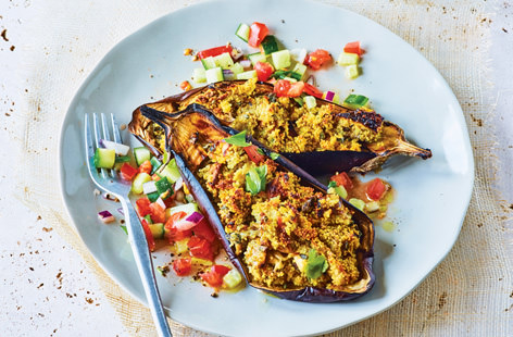Savour the spices of Morocco with this succulent stuffed aubergine recipe. Filled with a spiced cous cous and served with a fresh cucumber and tomato salsa salad, this makes an easy vegetarian and dairy-free midweek meal. 