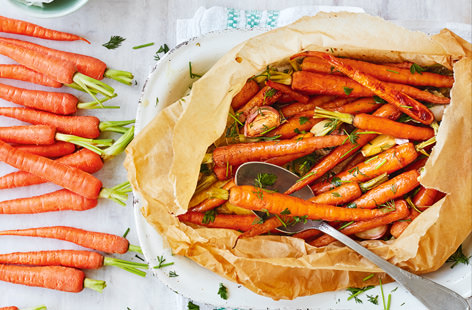 Make the most of this season's stunning tendersweet carrots - this simple side dish sees them tossed in fragrant garlic, a bay leaf and some seasoning, before being topped with dots of butter, wrapped up in a parcel and baked.
