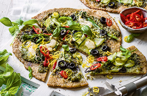 Make homemade pizzas in 30 minutes with this easy midweek recipe. The simple base uses just two ingredients – yoghurt and wholemeal flour – and is topped with vibrant pesto, charred broccoli and delicate courgette ribbons for a green twist on a classic.
