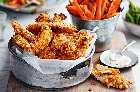 These crunchy, chicken goujons coated in a 'krispy' batter and served with a side of healthy carrot 'fries', are great for a quick mid-week meal your kids will love