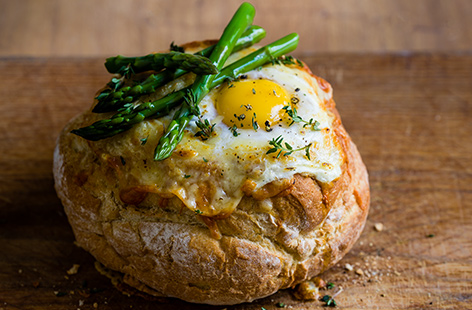 For a hearty brunch or lunch to share, try these quirky eggs in a basket. Fill a toasted bread bowl with gooey melted cheese, spicy chorizo sauce and a perfectly cooked egg for a generous meal for two. 