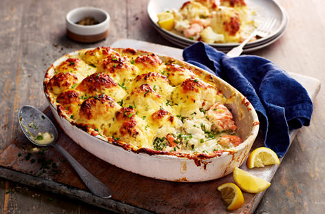 Sure to impress, this cauliflower-topped fish pie is the perfect winter warmer. The creamy sauce is flecked with chives and has a spoonful of dijon mustard for a little added warmth