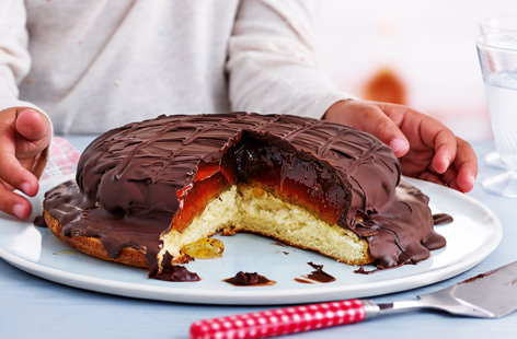 Little ones will love helping to make this giant version of the classic jaffa cake recipe. A light and springy sponge base is topped with chilled orange jelly, which is then covered in a layer of melted dark chocolate and set to create the crunchy outer layer