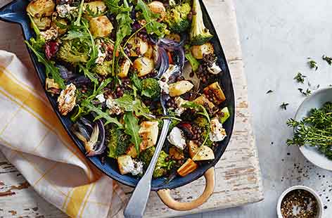 This vegetarian traybake makes a hearty meal using just one roasting dish, saving on the washing up! Caramelised roast veg are topped with ready-to-eat lentils and creamy goat's cheese for a hassle-free dinner