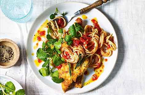 This traditional Italian dish feels indulgent but only takes 30 minutes to make, meaning it is an easy treat to make for dinner after work. Herby tomato sauce is stirred through spaghetti and topped with crispy breaded pork for a delicious meal for two.