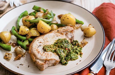 Packed with gorgeous Latin flavours, this easy pork recipe is just what you need to spice up your midweek meals. The mojo sauce, loaded with lime, chilli and coriander, tastes heavenly served with the juicy pork steaks and cumin-spiced potatoes