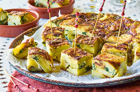 These Spanish tortilla bites, studded with spinach and artichoke, are the ultimate tapas dish and are perfect for feeding a crowd 
