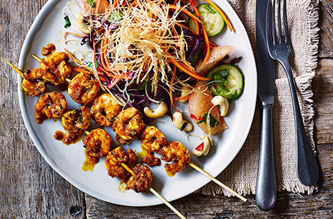 Bring some zingy, fresh Thai flavours to your next Friday night dinner with this easy prawn skewer recipe. Flavoured with red Thai curry paste for a spicy kick and served with a vibrant grapefruit and crunchy veg salad, this makes a delicious dinner for 2.