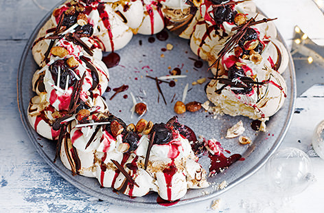 No festive celebration is complete without a show-stopping dessert and this black forest wreath is a centrepiece that's sure to impress. Crisp, chewy meringue is drizzled with dark chocolate, a fruity compote and scattered with caramelised nuts