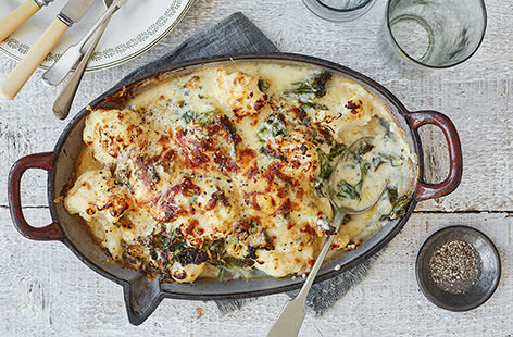 Creamy cauliflower cheese is one of those sides that always steals the show. We've added crispy kale and a gooey blend of cheddar, manchego and hard cheese for a heavenly bake that will transform your roast dinner.