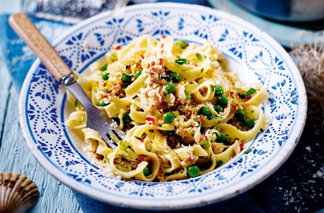 This seafood recipe is super speedy! You can be sitting down to a bowlful of steaming hot seafood pasta in just 12 minutes. It's a great way to use crab meat and makes the most of a classic flavour combination