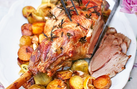 Celebrate Easter with a crowd-pleasing roast that's brimming with delicious spring flavours. This easy recipe gives gorgeous, rosemary-studded roast lamb with roasted new potatoes, artichoke hearts and lemon slices – a cracking Easter lunch