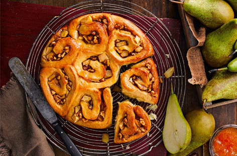 Juicy conference pears add a delicious sweetness to these soft and fluffy breakfasts buns complimenting their nutty and apricot centre. Pull them apart and enjoy them still warm, fresh from the oven. 