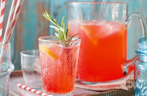 We've given classic lemonade a fruity, fiery makeover. A sweet lemon and raspberry syrup, infused with fragrant rosemary, is served in a pitcher packed with ice and topped up with warming ginger beer
