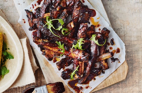 Get stuck in to these wonderfully sticky-sweet chilli spiced pork ribs. Cooking low and slow in foil parcels gives tender meet that really falls off the bone, and finishing on the barbecue with a balsamic-cranberry glaze brings smoky flavour and satisfying