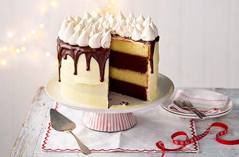 Sit back and relax with a slice of this spectacular s’mores layer cake, topped with crispy little meringues and a decadent drizzle of dark chocolate. Heaven!