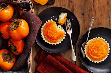 The delicate flavour of persimmons (also known as Sharon fruit) is a perfect match for rich, warming cinnamon in these heavenly tarts. Why not brush them with an apricot jam glaze for a stunning, vibrant finish?