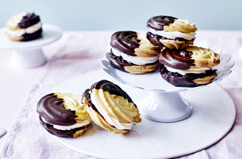 Ever thought that classic, melt-in-the-mouth Viennese whirls couldn’t be improved upon? There’s a very good chance these chocolate-dipped versions, sandwiched with morello cherry jam and luscious buttercream, will change your mind.