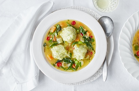 Make the most of spring's best ingredients with this warming broth made with spring onions, leeks and carrots and packed with homemade herby dumplings