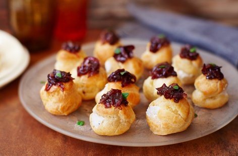 Made with light, crisp pastry, filled with creamy goat's cheese and topped with a sweet red onion relish, these delicious buns are perfect for serving as a canapé or starter