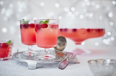 A Christmas cocktail that sure packs a punch! Sweet clementine combined with tart cranberry, a splash of vodka and a sprinkling of sugar, all topped up with soda water and garnished with fresh cranberries and mint