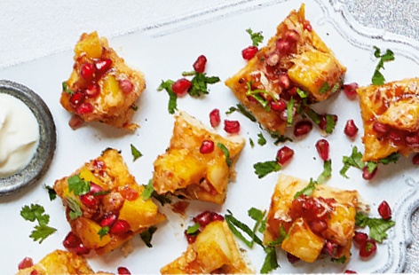 Indian meets Italian for this tasty party nibble –  made with naan bread, Bombay potatoes and Cheddar cheese these bitesize pizzas will disappear in no time