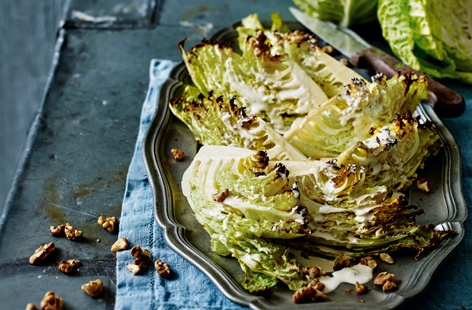 This vivid green cabbage is in harvest this festive season and its deliciously nutty flavour makes it a crowd-pleaser. Paired with the crunch of toasted, slightly bitter walnuts and a velvety cheese dressing, this dish is sure to please your veggie guests.