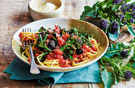 Purple sprouting broccoli is at its best from January through to April and its robust, earthy taste makes it a great match for the rich flavours in this tomato and olive sauce.